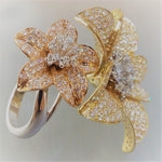 gold avatar ring with flowers filled with diamonds 