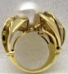 Australian pearl set in a magnificent gold and diamond ring viewed from the side