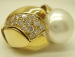 Australian pearl set in a magnificent gold and diamond ring seen from an angle