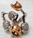 Festive bells designed in a stunning 18K gold ring with diamonds and with movable hammer