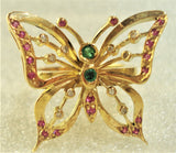 Butterfly with gemstones inserted into an 18-karat gold ring