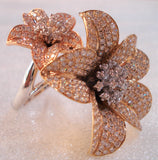 gold avatar ring with flowers filled with diamonds  seen  from an angle