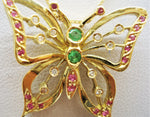 Butterfly with gemstones inserted into an 18-karat gold necklace