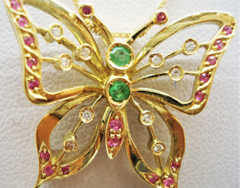 Butterfly with gemstones inserted into an 18-karat gold necklace