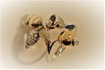 Festive bells designed in a stunning 18K gold ring with diamonds and with movable hammer and details