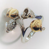 Festive bells designed in a stunning 18K gold ring with diamonds and with movable hammer  seen in front