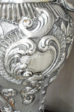 Silver amphora chiseled by hand with details