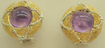 Cabochon amethyst set in an 18-karat gold earring chiseled by hand with details