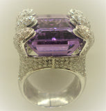 Amethyst ring set with 6 snake mouths filled with brilliants