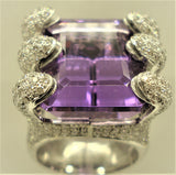 Amethyst ring set with 6 snake mouths filled with brilliants viewed from the front